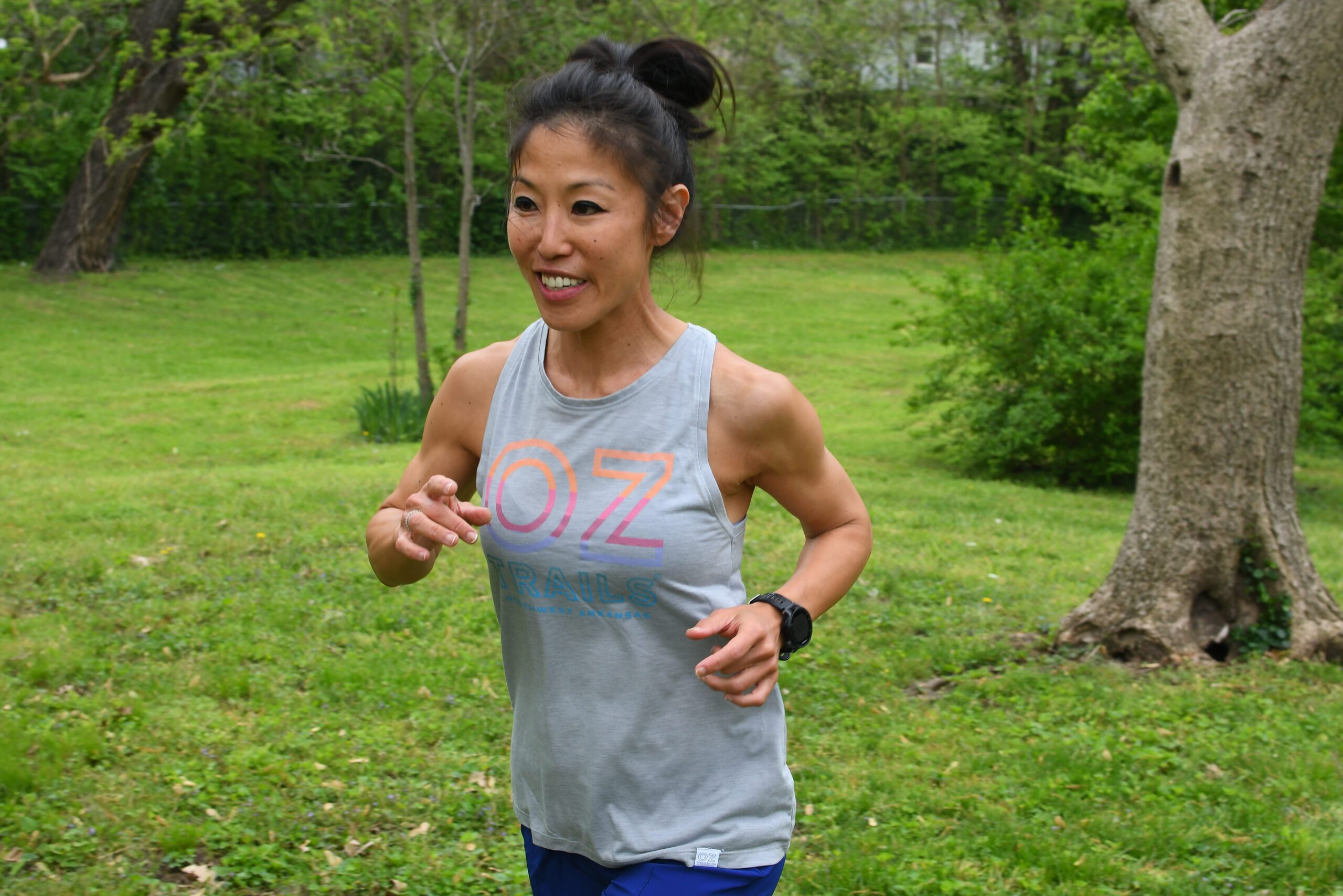 Woman running with trails in the background